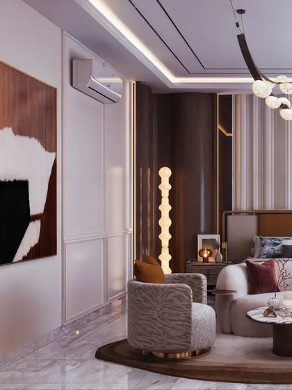 This view showcases the seating area within the bedroom, featuring a patterned armchair and a large piece of abstract art. The lighting from the floor lamp creates a cozy corner.