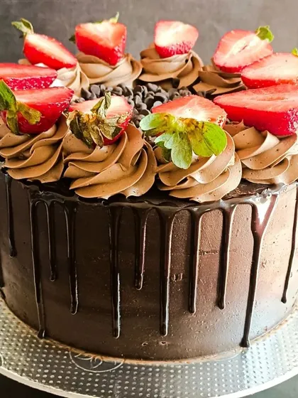 You can never go wrong with a classic. My Death by Chocolate cake is pure indulgence, with a rich, moist chocolate sponge, silky ganache, a dramatic drip effect, and topped with fresh strawberries.