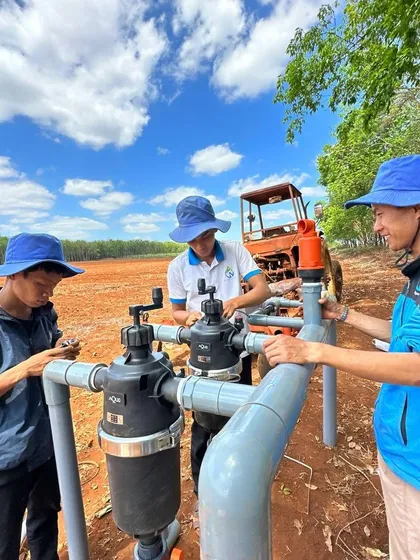 Our technical team collaborating with local farmers in Vietnam during an installation. We provide hands-on support to ensure our systems are set up correctly for long-term reliability.