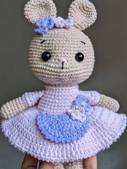 The full bunny doll held in hand.