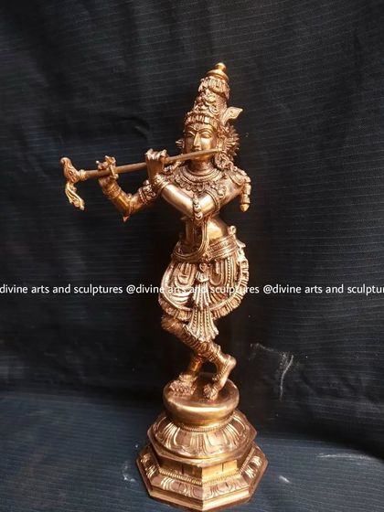 A 12-inch Panchaloha sculpture of Lord Krishna playing his flute. The dynamic Tribhanga (three-bend) posture is a classic feature of Krishna iconography that we capture with grace.