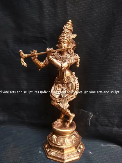 A 12-inch Panchaloha sculpture of Lord Krishna playing his flute. The dynamic Tribhanga (three-bend) posture is a classic feature of Krishna iconography that we capture with grace.