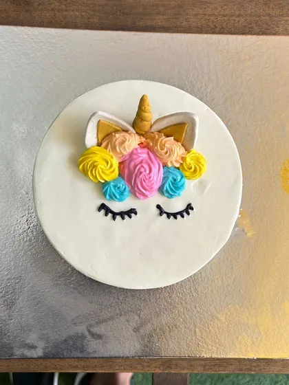 Our magical Unicorn cake, featuring a creamy yogurt topping and a horn made from rolled oats. A whimsical choice for a special pup.