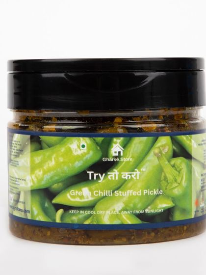A smaller jar of Green Chilli Stuffed Pickle on a white background.