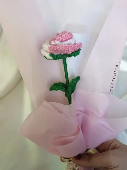 A clearer view of the single two-tone rose, showing the detailed stitch work on the petals and the vibrant green of the stem and leaves.