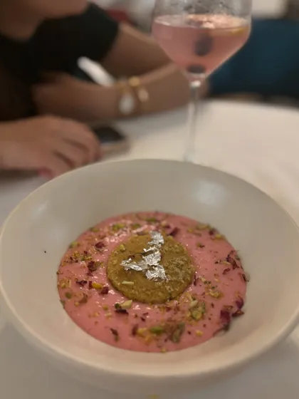 A creamy rose phirni from one of our special tasting menus. This traditional rice pudding is infused with rose water and topped with pistachios and a delicate biscuit.