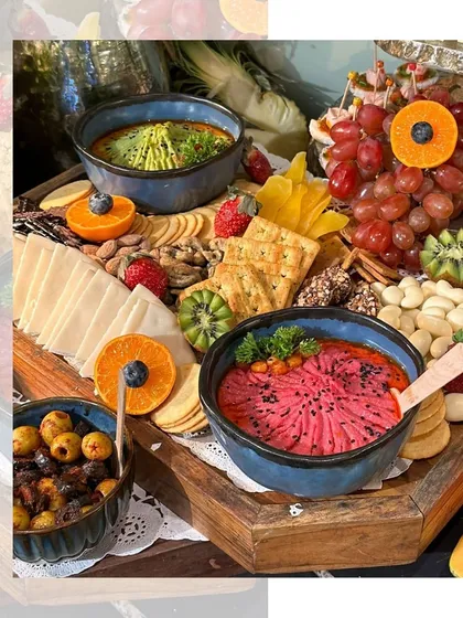 A close-up of our vibrant Mezze platter, featuring colourful dips, olives, nuts, and fresh fruits, all artfully arranged for a stunning presentation.