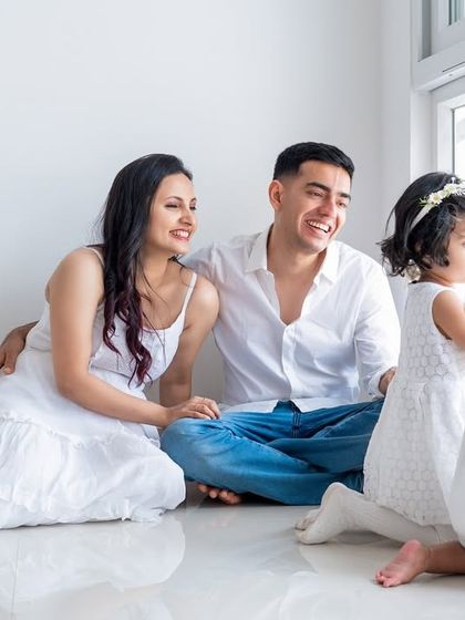 A candid moment of a family of four looking out the window together. These lifestyle shots tell a beautiful story.
