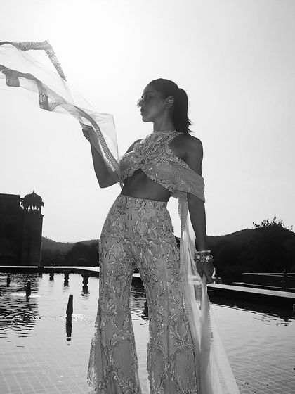 A black and white shot of the embellished sharara, highlighting its modern grace and the fearless fashion it represents.