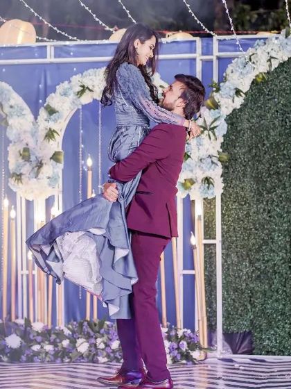 A stunning lift against a beautiful backdrop. This is the groom's bhaiya and bhabi, showing that every couple in the family can have their star moment.