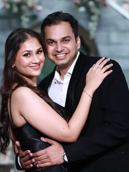 A happy and intimate pre-wedding portrait of a couple embracing, showcasing their genuine smiles and connection.