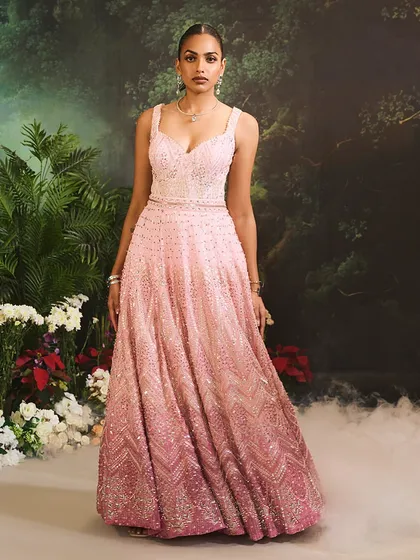 A frontal view of the Celine Gown, showing the sweetheart neckline and the continuous flow of the ombre embellishments from the bodice to the hem of the skirt.