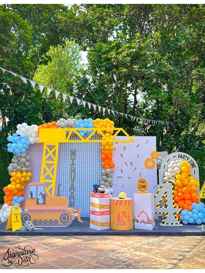 For a little one who loves to build, I designed this incredible construction zone party. The main backdrop features a custom crane, bulldozer, and personalised signage, creating an immersive and interactive play area for all the little builders.
