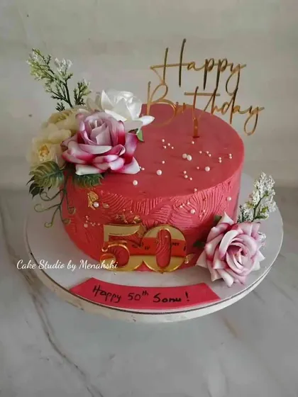 A 50th birthday deserves a bold statement. This vibrant hot pink cake is decorated with beautiful flowers and gold accents, and it’s made completely without fondant to let the delicious buttercream flavour shine.