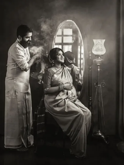 I provide every client with both color and classic black and white images because each tells a different story. This monochrome version of a vintage-themed couple's portrait strips away color to focus on the raw emotion, the dramatic lighting, and the intimate details of the scene.