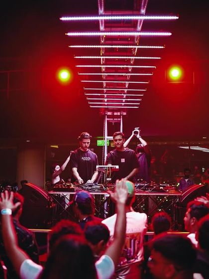The view from the crowd, looking up at the DJs on a raised stage. I design the layout of my events to ensure the DJ is the center of attention.