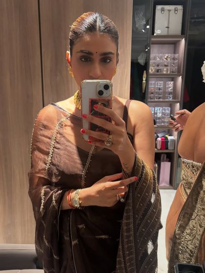 A selfie showing my festive makeup and jewelry. A simple bindi and gold jewelry are my go-to accessories for completing a traditional look.