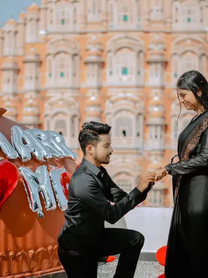 A surprise proposal setup in front of the magnificent Hawa Mahal. I can help you plan and capture these special moments, creating memories that will last a lifetime.