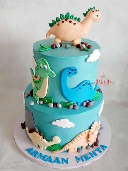 A two-tier dinosaur cake for Armaan's 6th birthday. He was very specific about which dinosaurs he wanted, so I handcrafted a Triceratops, Stegosaurus, Brachiosaurus, and T-Rex for his special day.