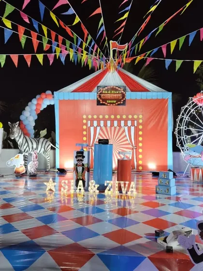A complete stage setup for a circus-themed birthday party. I handle all the details, including the custom printed big-top backdrop, themed flooring, and props like the ferris wheel and animal cutouts to bring the theme to life.