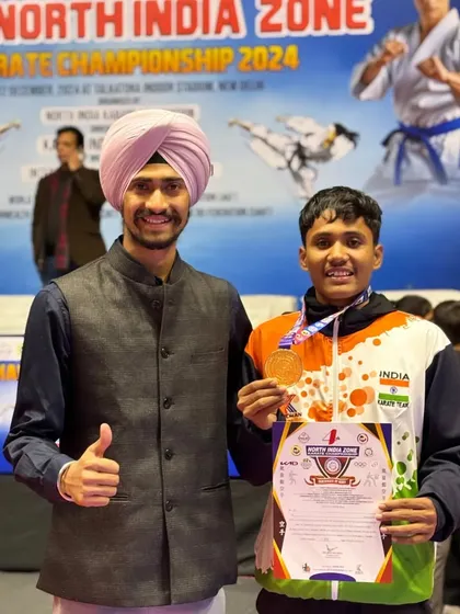 Mentoring the next generation of champions. Here I am with a promising young athlete from Team India after his win at the North India Zone Karate Championship. My goal is to pass on the knowledge and mindset required to reach the top.