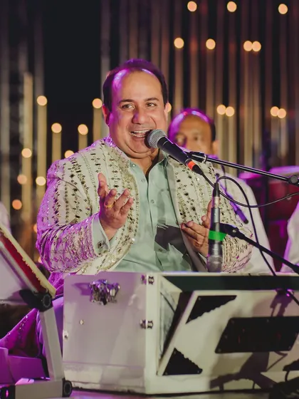A close-up of Ustad Rahat Fateh Ali Khan, whose voice can fill any venue with profound emotion. We curate these moments of pure musical bliss.