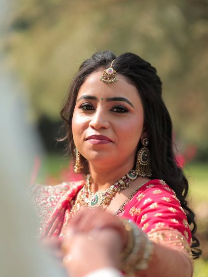 An intimate close-up of the couple. Her makeup is soft and romantic, perfect for these cherished moments.