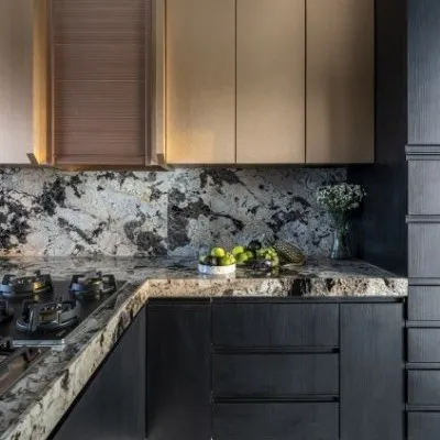 I believe a kitchen should be as daring as it is functional. In this Mumbai penthouse, I moved beyond conventional design, fusing burnished copper and obsidian black to create a sculptural masterpiece. This is not just a place to cook; it's a stage for culinary art.