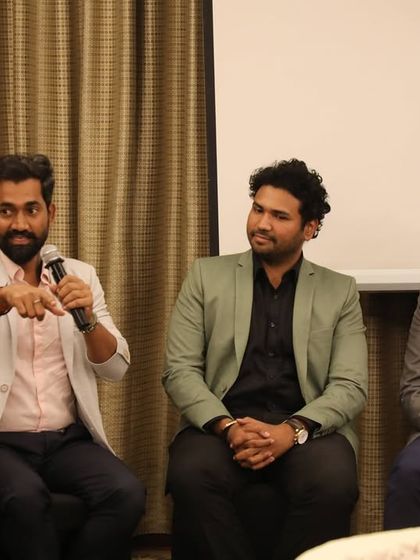 A moment from the engaging panel discussion. We are passionate about sharing our insights on architecture, construction, and design.