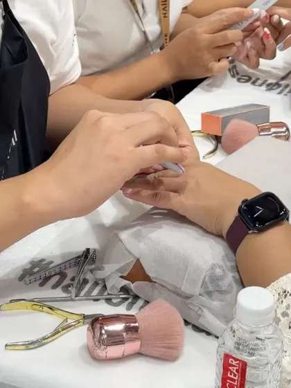 A behind-the-scenes shot of a manicure in progress. We use professional tools and maintain the highest standards of hygiene for your safety and comfort.