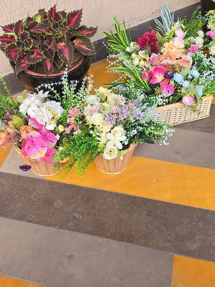A behind-the-scenes look at the fresh flower baskets ready to be used in one of my decor setups. I use a mix of high-quality blooms to create my arrangements.