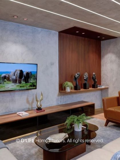 A living room that perfectly balances modern and industrial elements. The concrete-finish wall with integrated LED strips creates a stunning visual effect.