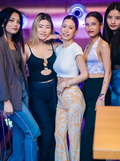 A group of friends posing together, showcasing their unique styles.