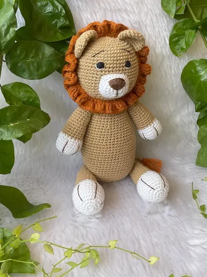 This large lion in a soft beige color is so huggable. His gentle expression and soft mane make him a comforting friend for children.