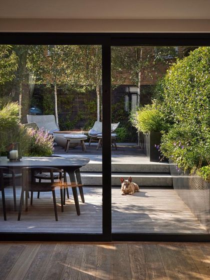 This project shows how we can create a seamless transition from indoors to a stylish outdoor deck. The elevated wooden deck provides a perfect space for dining and relaxing, extending the home's living area into the garden.