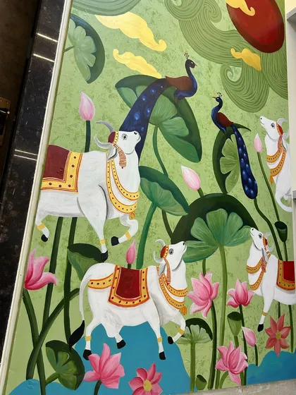 Another angle of the completed Pichwai wall art. The composition is designed to draw the eye upwards towards the sun, creating a sense of wonder and devotion.