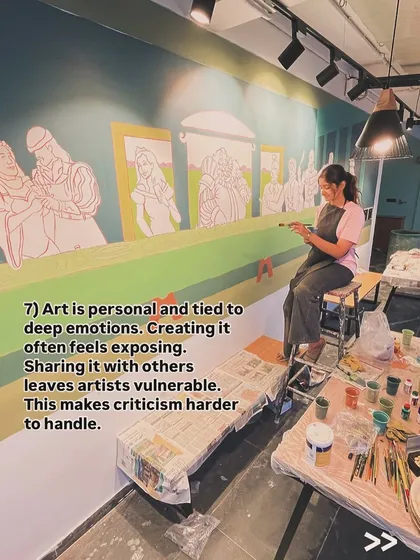 Creating art is personal and can feel exposing. This image captures me working on a large, story-driven mural, a process that requires vulnerability and makes handling criticism a unique challenge for any artist.