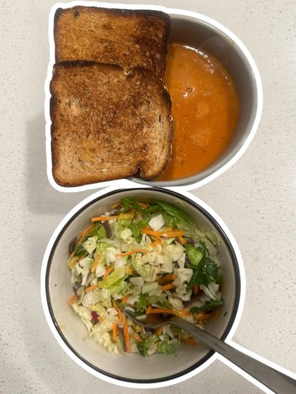 A comforting meal of tomato soup, whole wheat toast, and a fresh salad. Simple, nourishing, and easy to prepare.