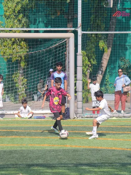 A tense moment in the penalty area as our player prepares to take on a defender.