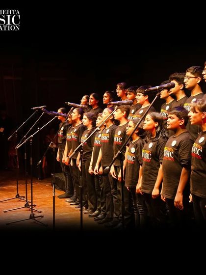Our youth choir stands ready to perform, a unified ensemble of voices poised to inspire the audience.