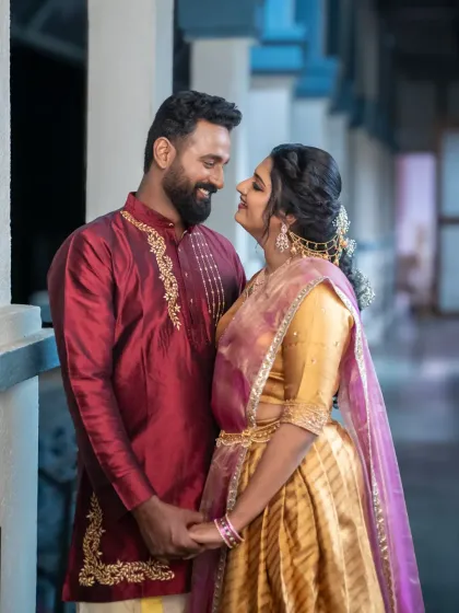 A classic, romantic portrait of the couple. The beautiful lighting and their loving gaze create a timeless image from their engagement shoot.