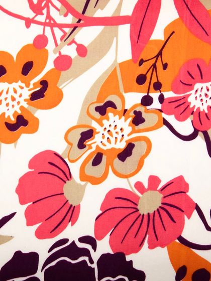 A close-up shot of the floral fabric, focusing on the details of the print and weave.
