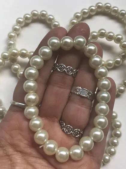 A handful of my handmade pearl bracelets, ready to be shipped out. Their simplicity is what makes them so popular as gifts for all ages.