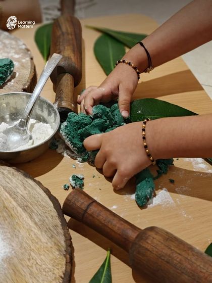 This image captures the focused effort of a child engaged in playdough exploration. This kind of hands-on play not only builds physical skills but also calms the mind and encourages creativity.
