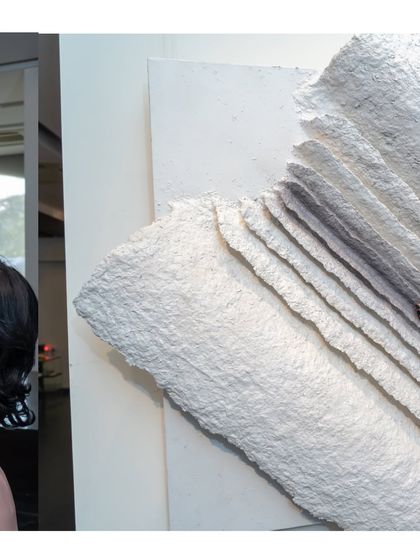 A side view of "The Flight of Knowledge," highlighting its sculptural, three-dimensional quality.