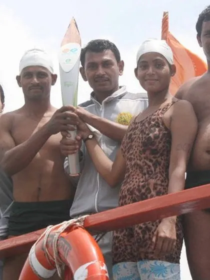 With fellow swimmers and runners during the Youth Commonwealth Games baton relay. This event brought together athletes from different disciplines to celebrate the spirit of sports.