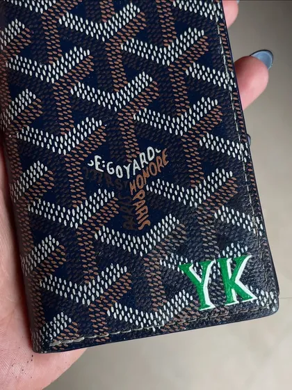 A simple and elegant personalization. I hand-painted the initials "YK" in green on this Goyard card holder.