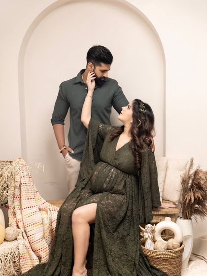 The wait is sweet, the journey is precious. This boho-chic couple's maternity shot captures a tender, loving glance in a beautifully styled, earthy setting.