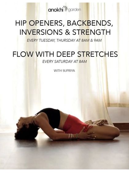 A student demonstrates Supta Virasana, a deep reclining stretch, during a Flow with Deep Stretches class. This practice focuses on releasing tension in the hips and back, promoting flexibility and relaxation.