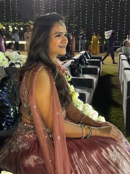A quiet moment amidst the Sangeet celebrations, taking in the beautiful decor and happy atmosphere.